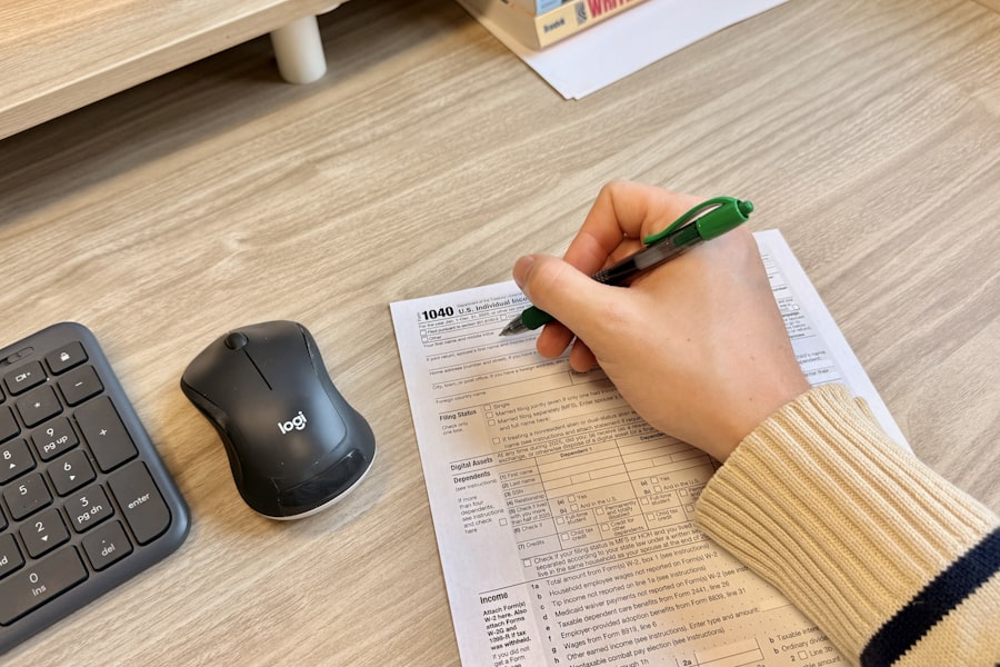 A person signing documents at a table