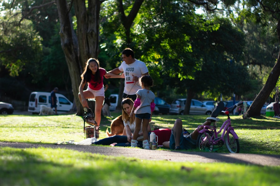 A family sitting together on grass outdoors