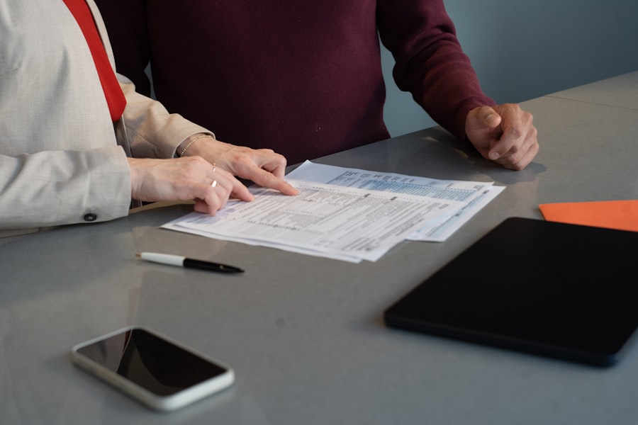A person reviewing paperwork at a desk