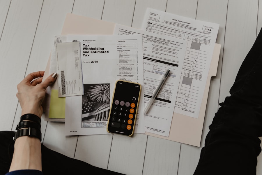 A calculator and budget papers on a desk