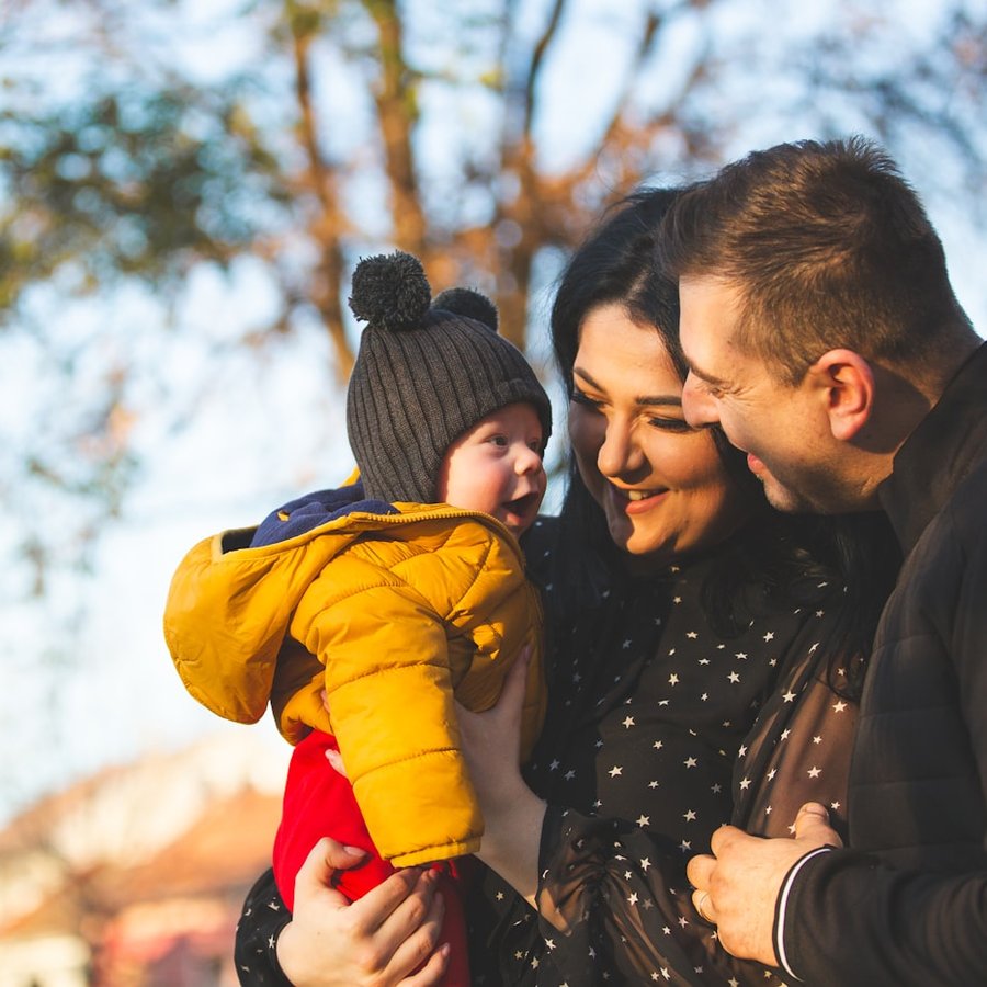 A family laughing together outdoors